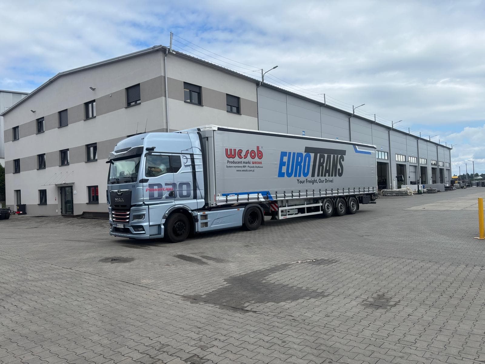 EuroTrans truck — MAN tractor with a curtainsider trailer