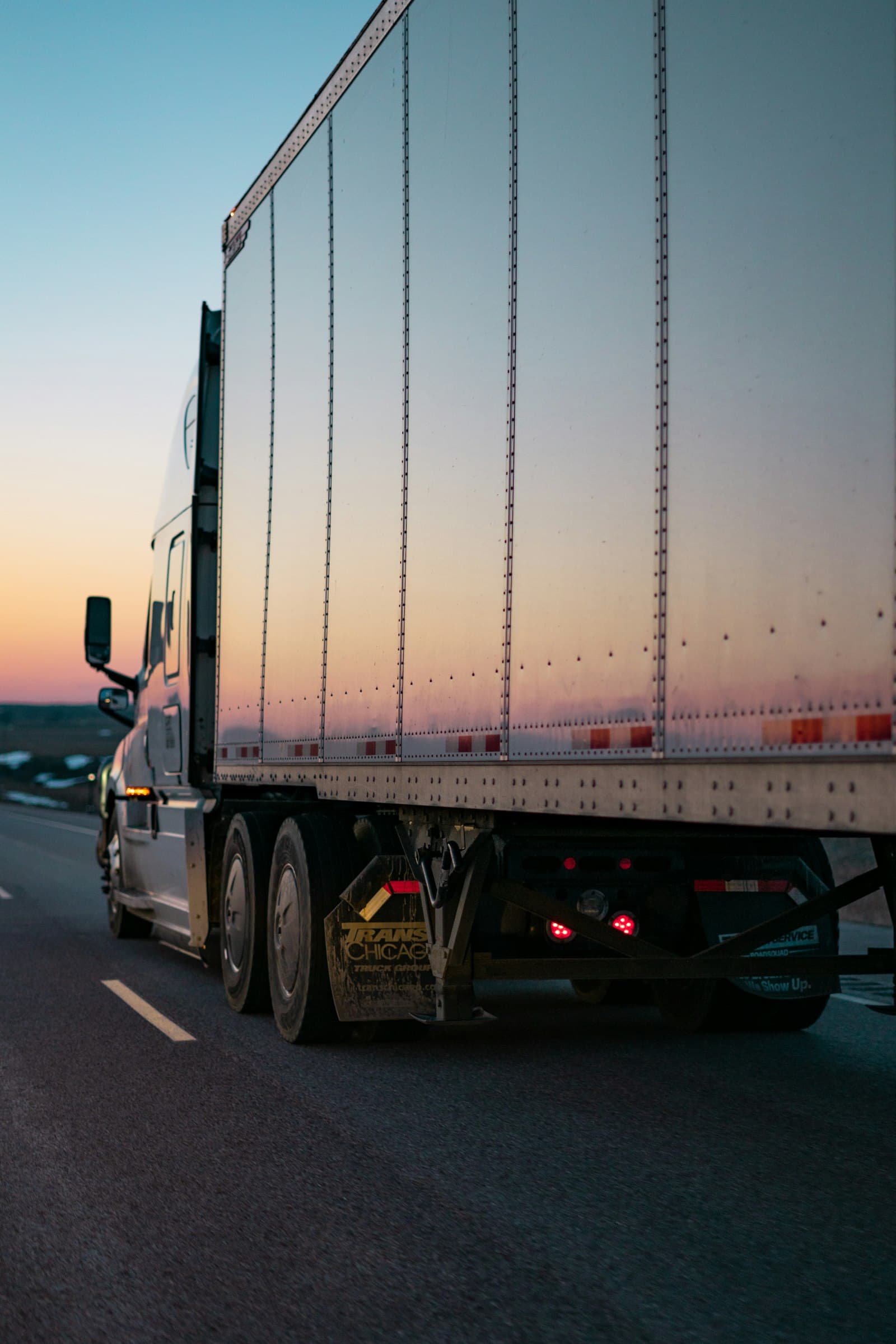 Truck trailer on the road at dusk